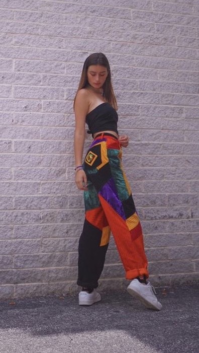 Maya Anstine wearing her favorite thrifted item. She found these extravagant pants at Community Aid. 
