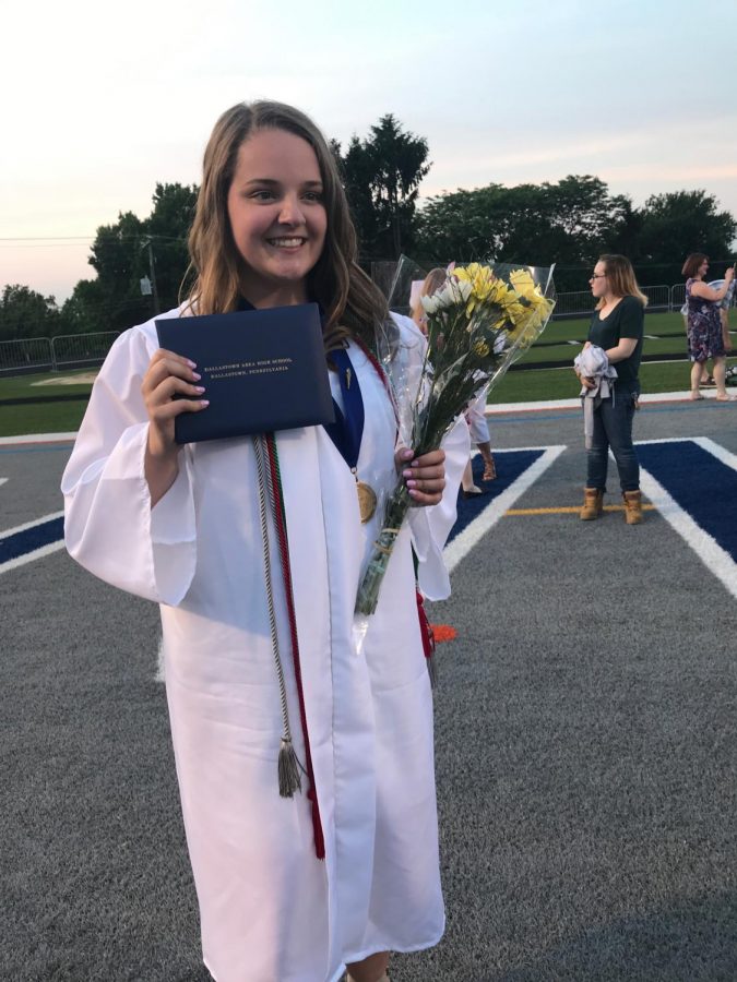 2018 DHS Graduate, Lydia Williams poses after graduation with all her cords. 