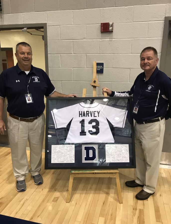 Athletic director, Tory Harvey (right), received a jersey and varsity letter in honor of his retirement. Vince Sortino (left), the new athletic director, was there to honor Harvey.