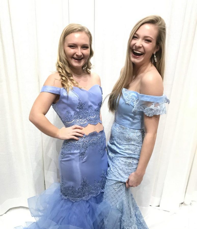 Senior Brooke Luckenbaugh (left) poses with another RenRep during a recent photoshoot. RenReps participate in photoshoots to display Prom 2019 dresses. Photos are posted on Instagram and Facebook. 