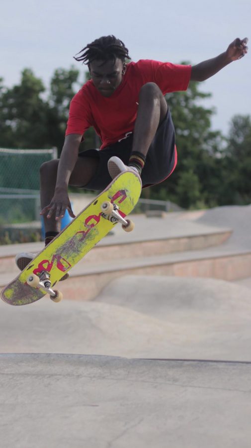 Dallastown senior Charles Asah, does an Indie grab off of a ramp at Reid Menzer. Asah is not letting recent violence keep him from skating at the park. 