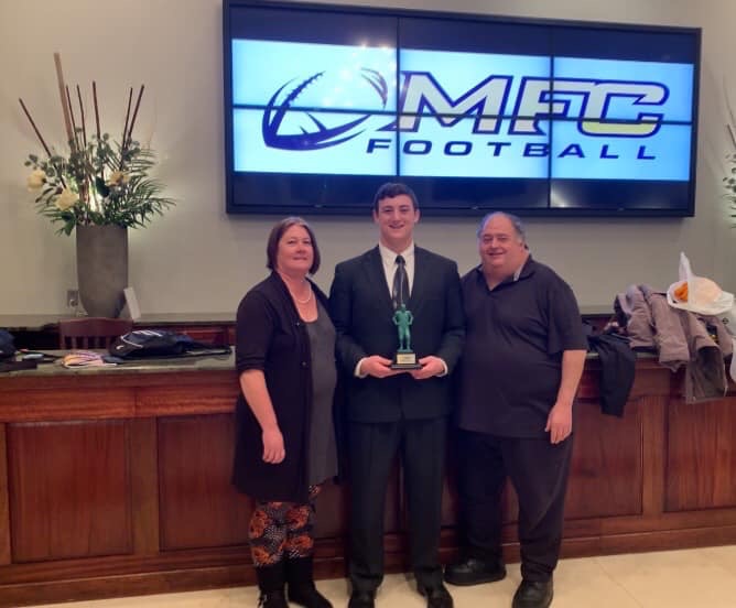 Dallastown lineman Raymond Christas and his parents attended the Mini-Maxwell Award ceremony in January. Christas also won the Quarterback Club of York Scholarship. 