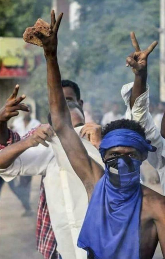 This iconic photo from an early uprising in Sudan shows citizens being tear gassed at a protest. The man depicted has become a symbol for the Sudanese people, some even dressing like him for current protests. 