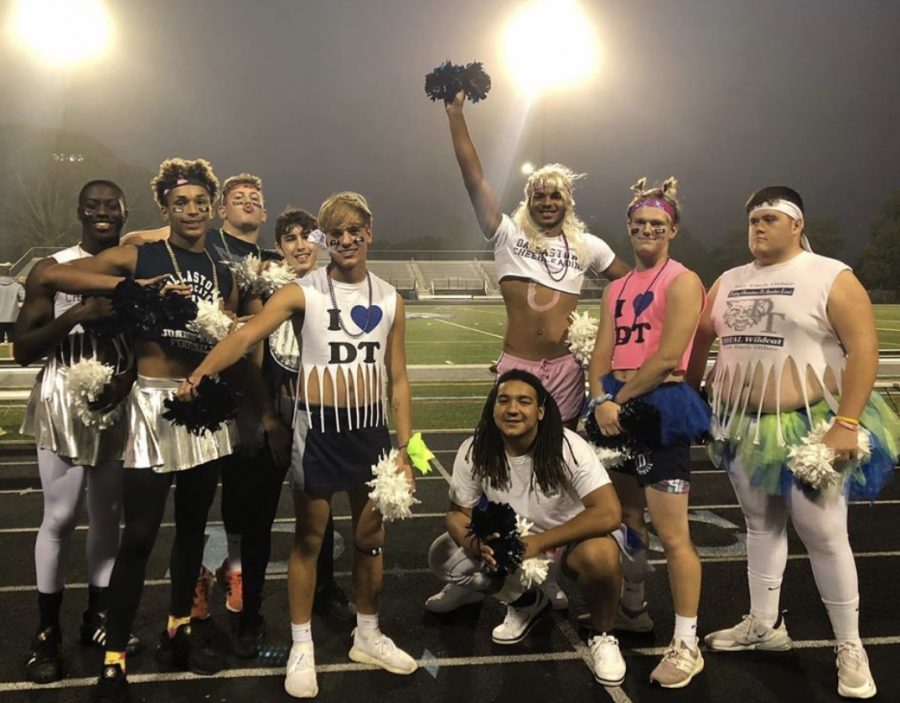 One of the favorite attractions of the annual Powder Puff game is on the sidelines. Senior football players dressed up as cheerleaders to support the players and to entertain the crowd. 