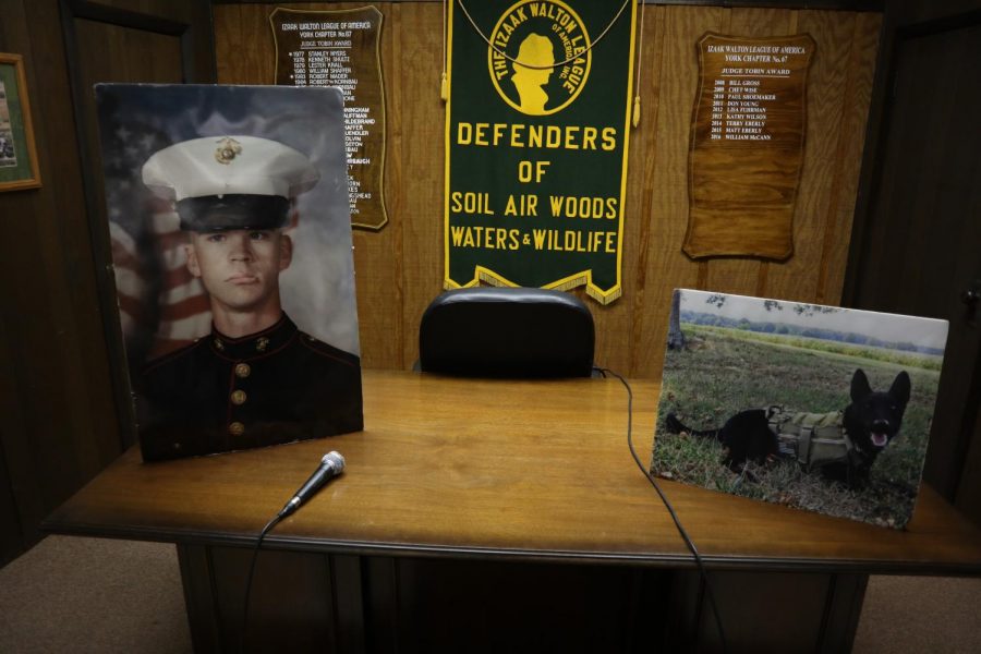 Photos of Sgt. Christoper M. Wrinkle, and his K9 companion, Tosca, shown at the ceremony in memorial of the two. 