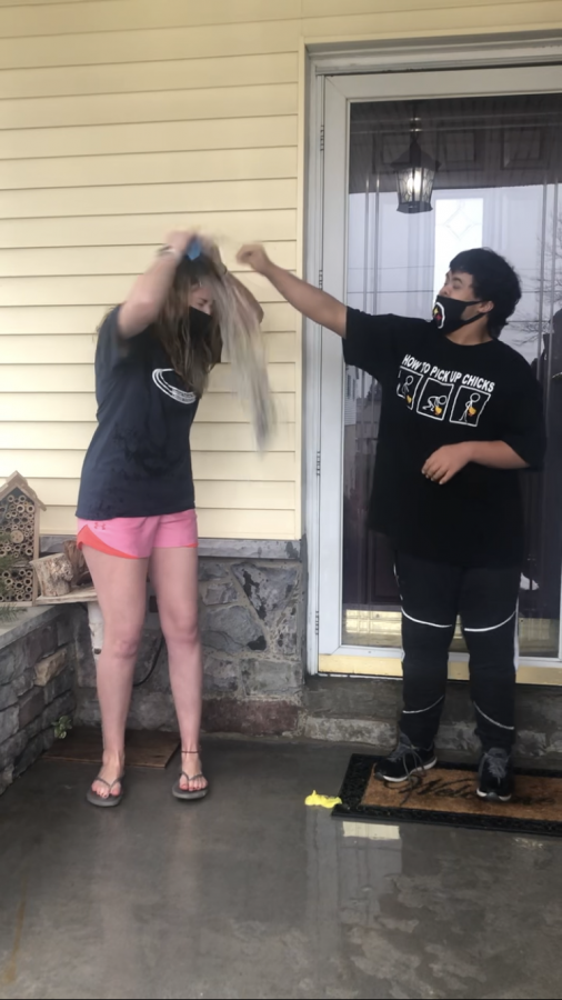 Dallastown senior Katie Queenan lets her friend Michael pop the ice-cold water balloon number one over her head on February 28. Queenan has been involved in Special Olympics and unified sports since her freshman year of high school. 