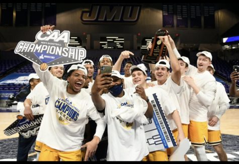 Former Dallastown graduate, Julian Adams (front left), celebrates with the Drexel men’s basketball team with their win in the CAA conference championship game. Winning the CAA championship helped Drexel into the NCAA Basketball Tournament. 