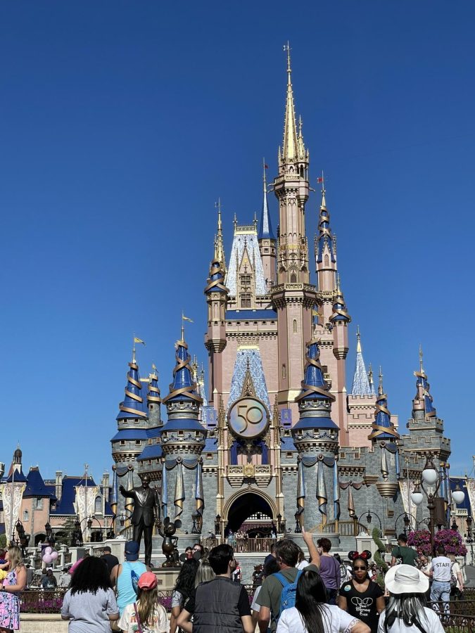 Magic Kingdoms castle decorated for Disney Worlds 50th anniversary celebration.