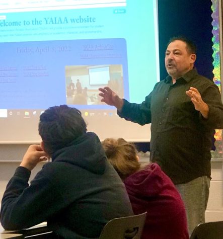 Steve Navarolli has been a sports journalist for 15 years. Hes had experience with the transition between print journalism and digital media. Here he is explaining to students how he is charge of updating sports scores on the YAIAA website.