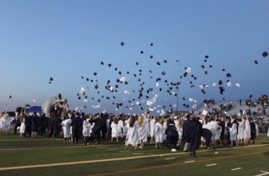 The Dallastown High School Class of 2017 celebrates with the traditional cap throw at graduation. The early graduation program allows students the chance to complete their coursework after trimester one or two and still be eligible to return to walk at the ceremony with their classmates. 