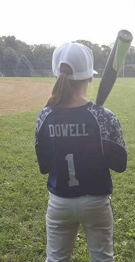 Alexi showing off her signature number in Little League #1. 