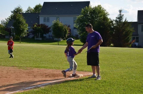 Alexi playing at Ore Valley Elementary in 8U. Her dad Matt Dowell is the first base coach. 