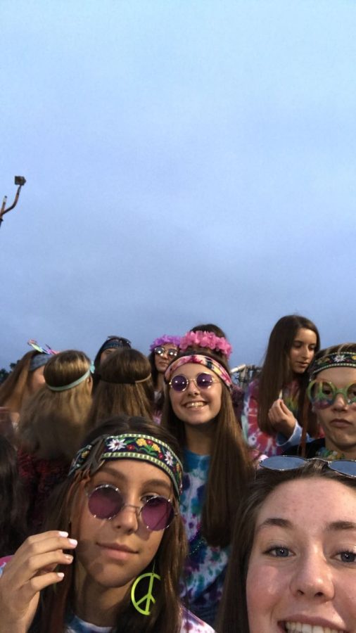 Class of 2022 in the student section freshman year for the decades/ hippie theme.