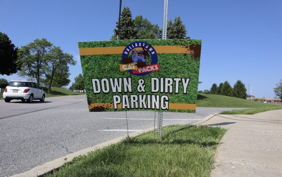 As participants of the Down and Dirty event arrive, there are several road signs that direct to parking.