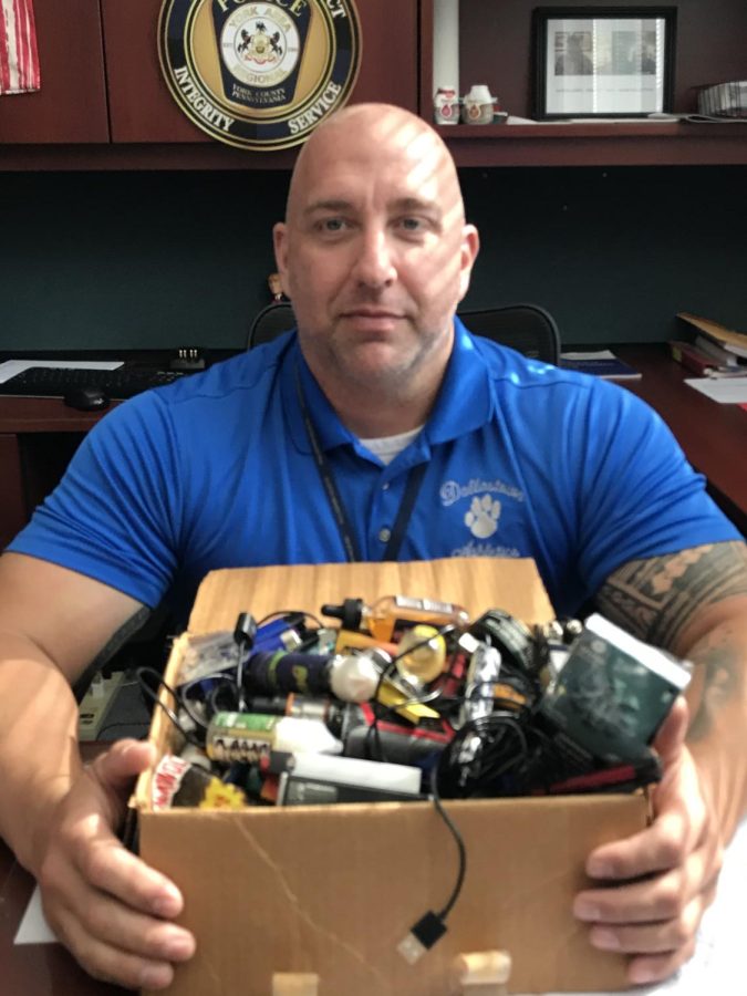 Dallastown Dean of Students Mr. Hostetter displays a large collection of vapes that have been confiscated in the high school. According to Hostetter, the new Halo Air Sensors are helping the school to get a handle on student vaping. 