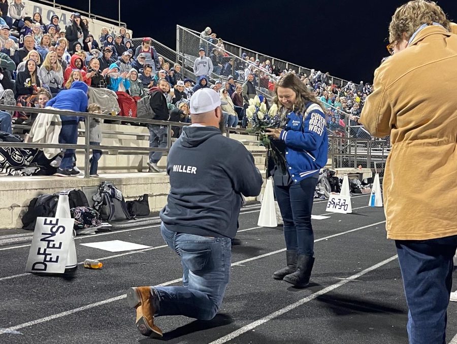 Dallastown football alum Jordan Miller used the Homecoming game as an opportunity to propose to cheer alum Brittany Lahr. The two were friends in high school when she cheered for him on the field. 