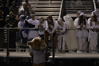 The game against Central was held on 9/30/22, in the stands, our school mascot Willy the Wildcat is talking to the student section kids. 