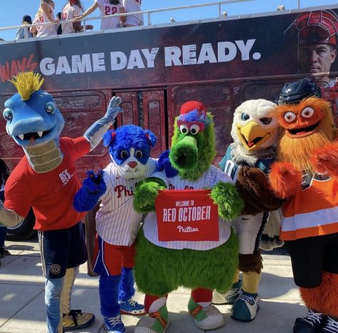 The Philadelphia sports teams mascots all take a picture together.