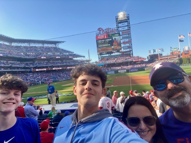 (___) teacher Allison Turnbull and her family at the playoff game this year against the Atlanta Braves.