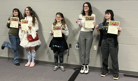 2022 Poetry Out Loud participants smiling for photos during the awards ceremony.