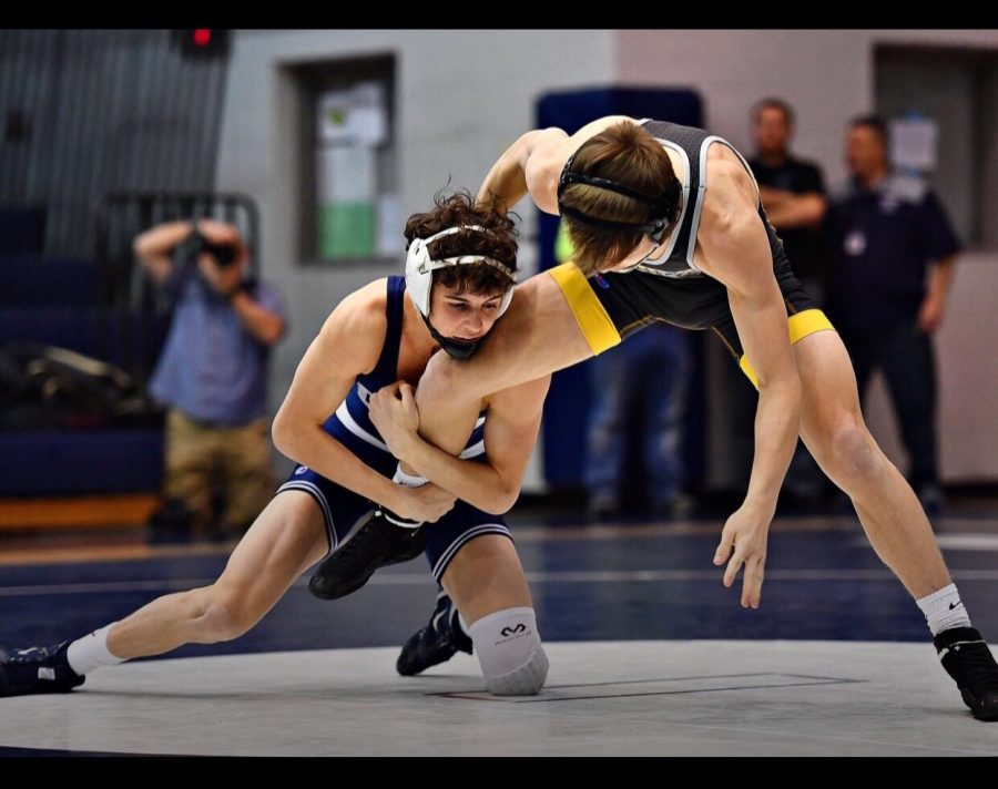 Turnbull shoots for a takedown in a match during his high school wrestling career.