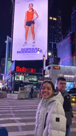 Dallastown Middle School student Sophia Rodriguez poses in front of a billboard in Times Square  featuring her as a record holder. 