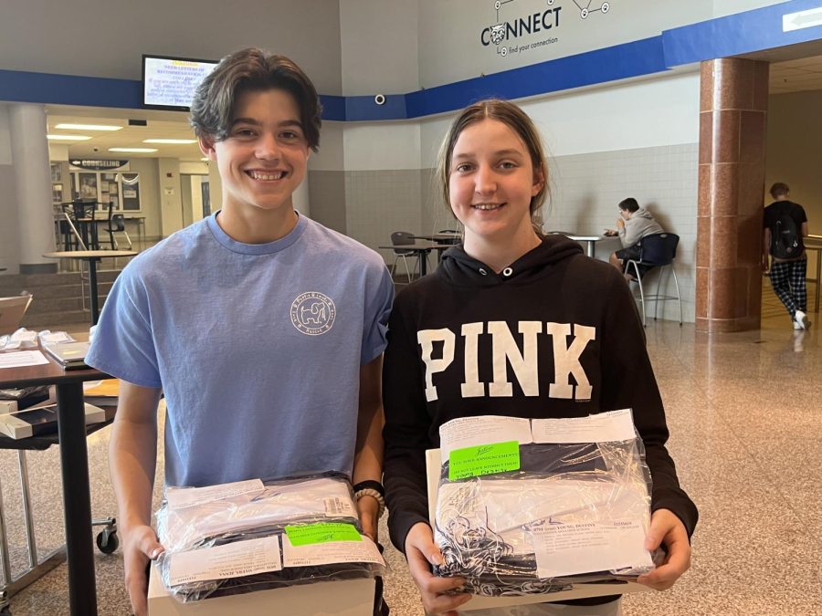 Two Seniors collect their caps, gowns, and cords for 2023 graduation. Handouts were done on Thursday, April 20 during lunch in the lobby as Seniors count the days until their high school career ends and a new life begins. 