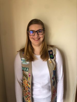Kylie Tauzin recently attained her Girl Scout Gold Award, completing her vest of badges.