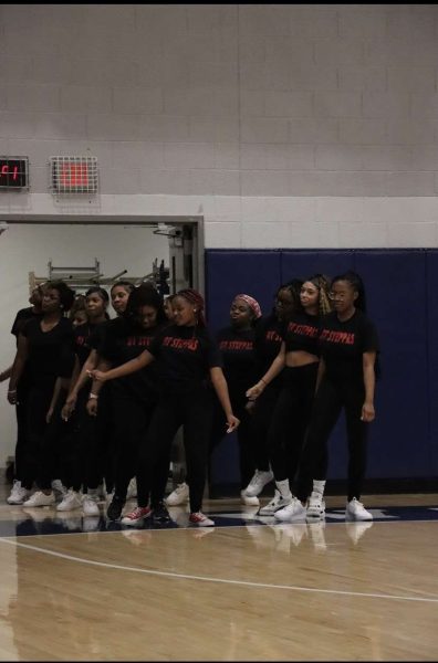 The DT Steppas, Dallastowns Step Team, enter the gym at one of their boys basketball halftime performances in January 2023. The team hopes to perform at Dallastown events this year as well. 