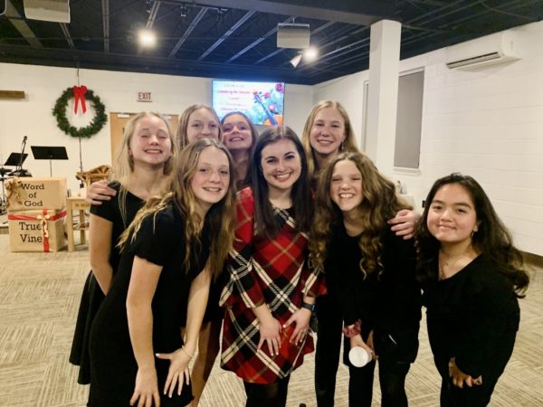 Middle School Music Teacher, Miss Trauger, is posing with some of her choir students after a performance. Trauger has recently won the Outstanding Young Music Educator Award from the Pennsylvania Music Educators Association. - Submitted By Trauger
