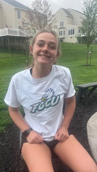 Senior Jillian Stefko poses with a shirt of the university she has committed to - Florida Gulf Coast.