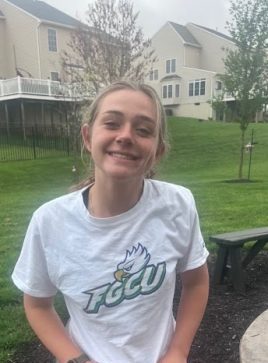 Senior Jillian Stefko poses with a shirt of the university she has committed to - Florida Gulf Coast.