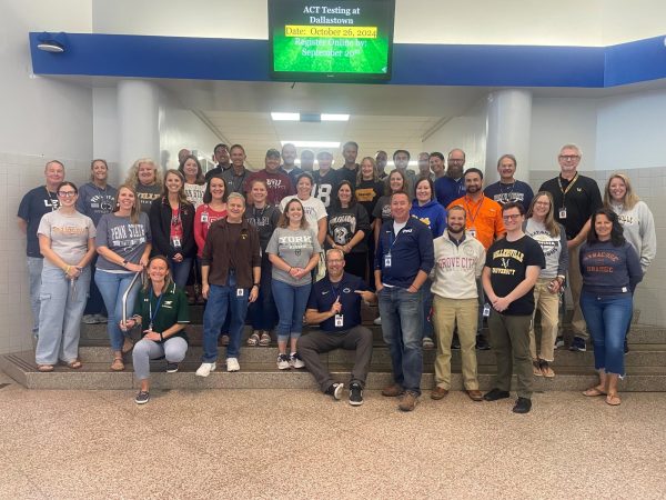 Members of the high school staff show off their college gear on Why Apply Day on Sept. 20. (Photo submitted) 