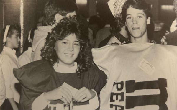 Students attending the 1987 Halloween dance in the Highschool's Lobby, dressed as packs of M&M's.