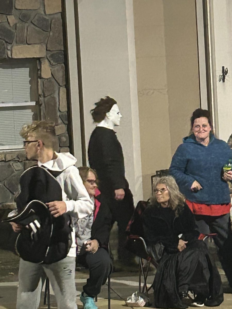 2022 Halloween parade viewer dressed as Micheal Myers.