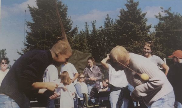 Two visitors of the 2001 Fall Festival participating in one of the many fun events held throughout the years at fall festival.