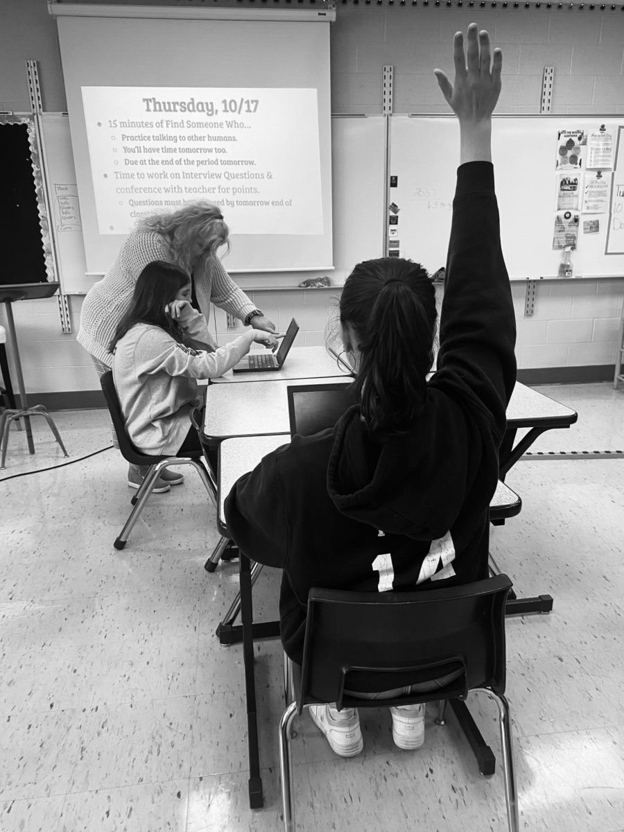 As English teacher Miss Gable helps a student in class, another is raising her hand for help. When students don't get the attention they need in a classroom, it can affect their learning. 