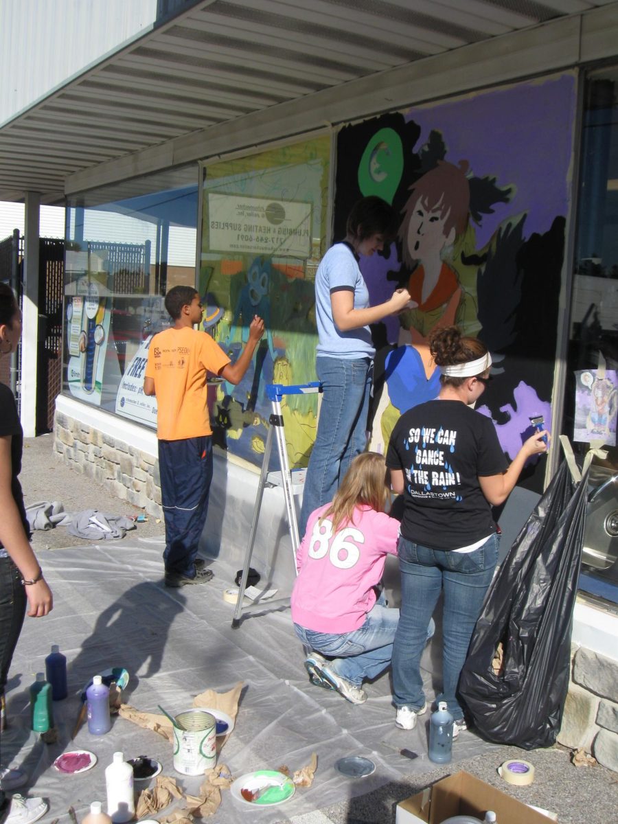 Art students painting their Halloween murals on local Dallastown businesses.