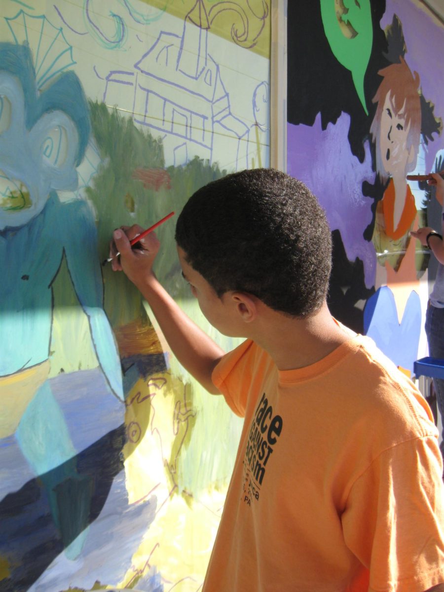 Art students painting their Halloween murals on local Dallastown businesses.