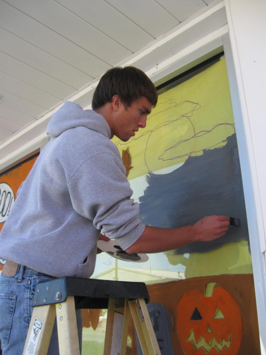 Art students painting their Halloween murals on local Dallastown businesses.