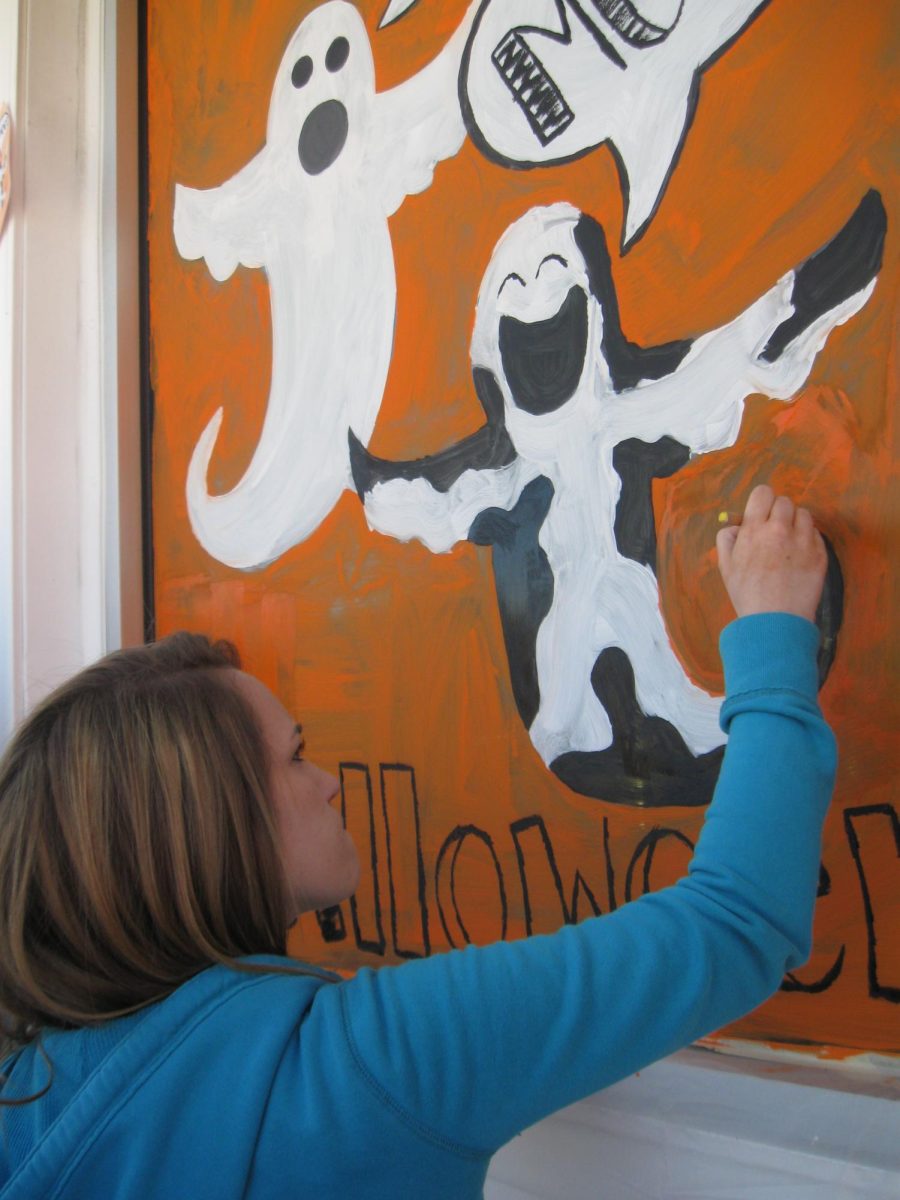 Art students painting their Halloween murals on local Dallastown businesses.