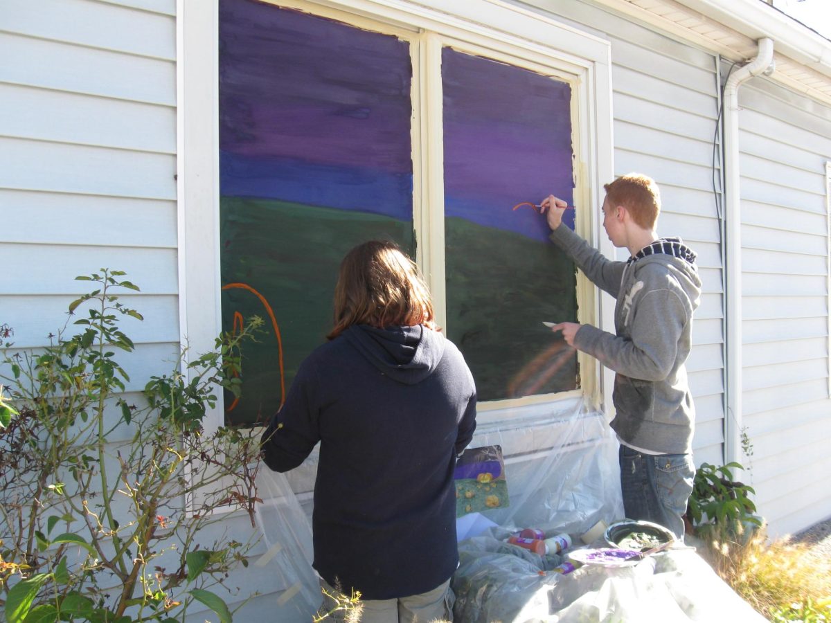 Art students painting their Halloween murals on local Dallastown businesses.