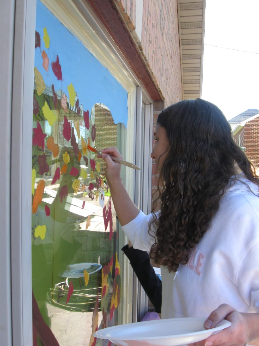 Art students painting their Halloween murals on local Dallastown businesses.