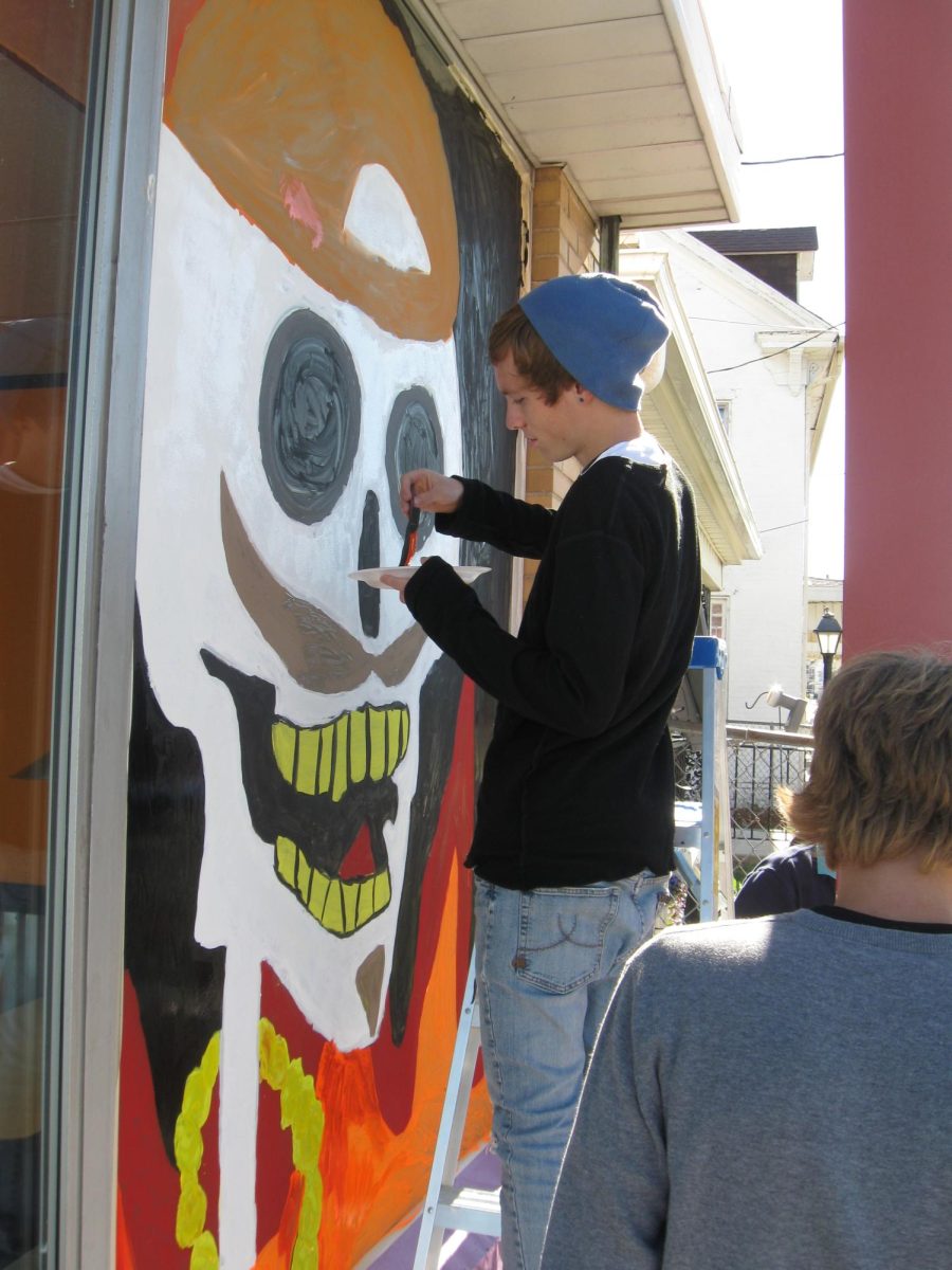 Art students painting their Halloween murals on local Dallastown businesses.