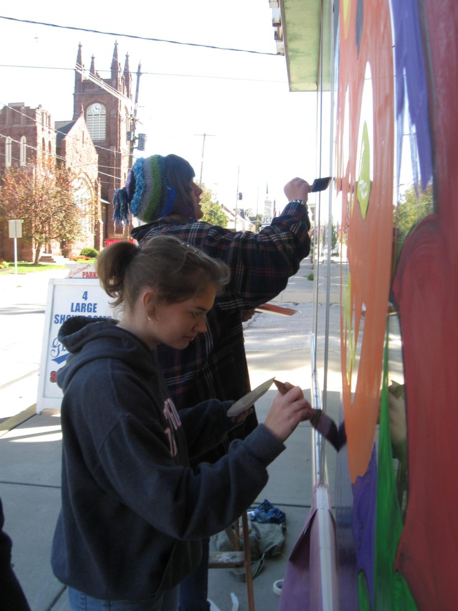 Art students painting their Halloween murals on local Dallastown businesses.