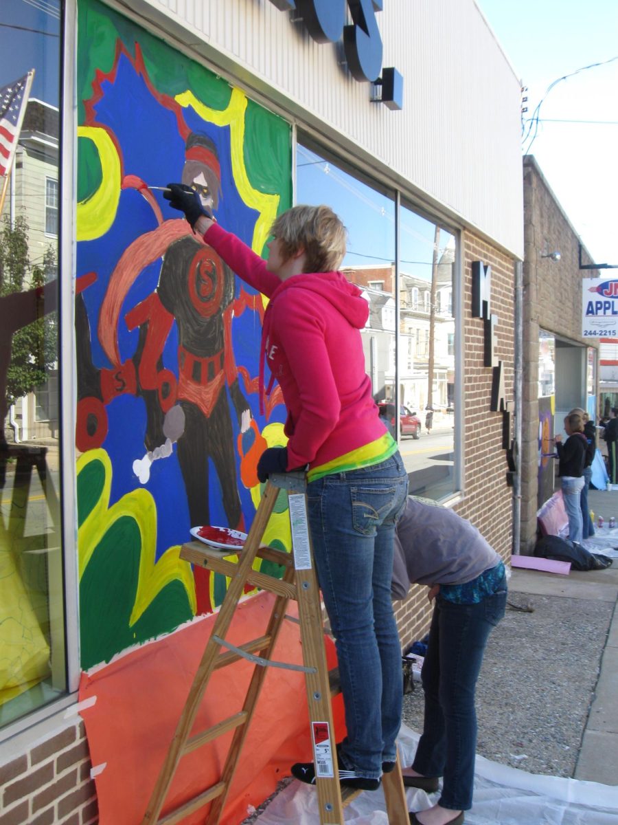 Art students painting their Halloween murals on local Dallastown businesses.