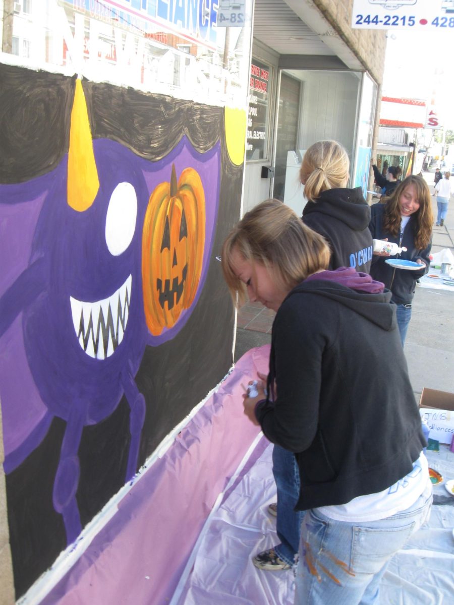 Art students painting their Halloween murals on local Dallastown businesses.