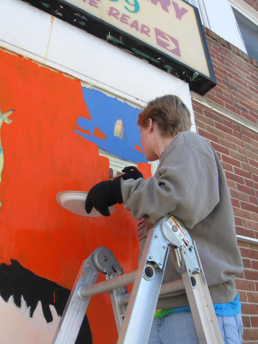 Art students painting their Halloween murals on local Dallastown businesses.