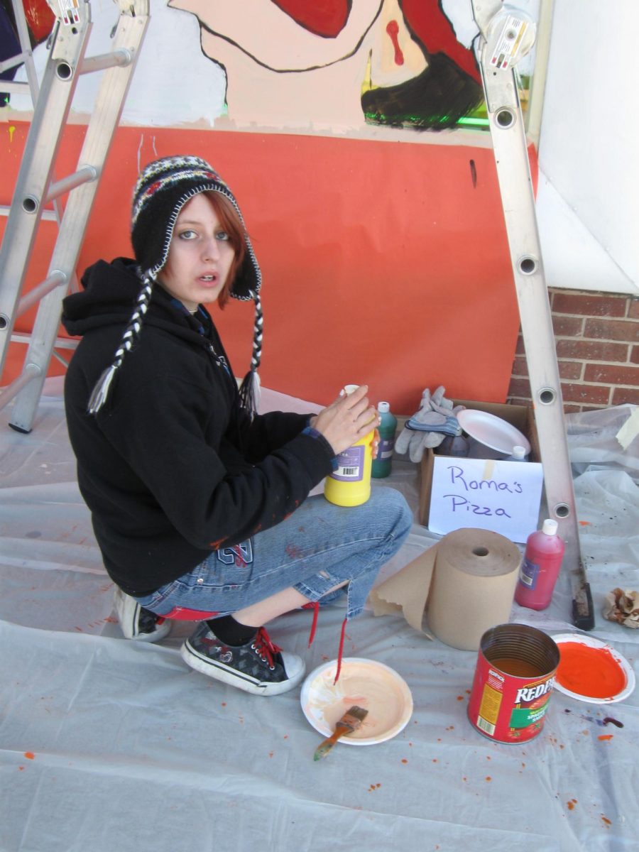 Art students painting their Halloween murals on local Dallastown businesses.