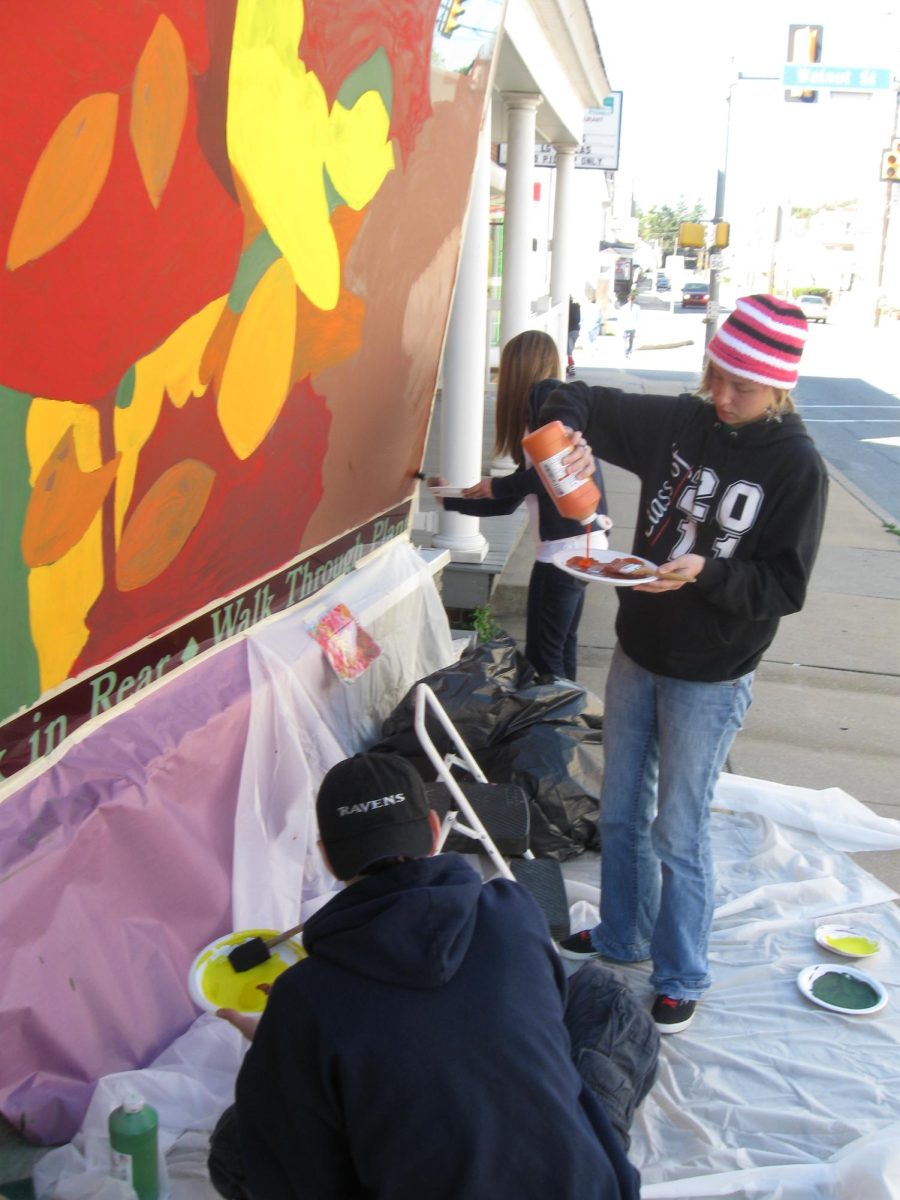 Art students painting their Halloween murals on local Dallastown businesses.